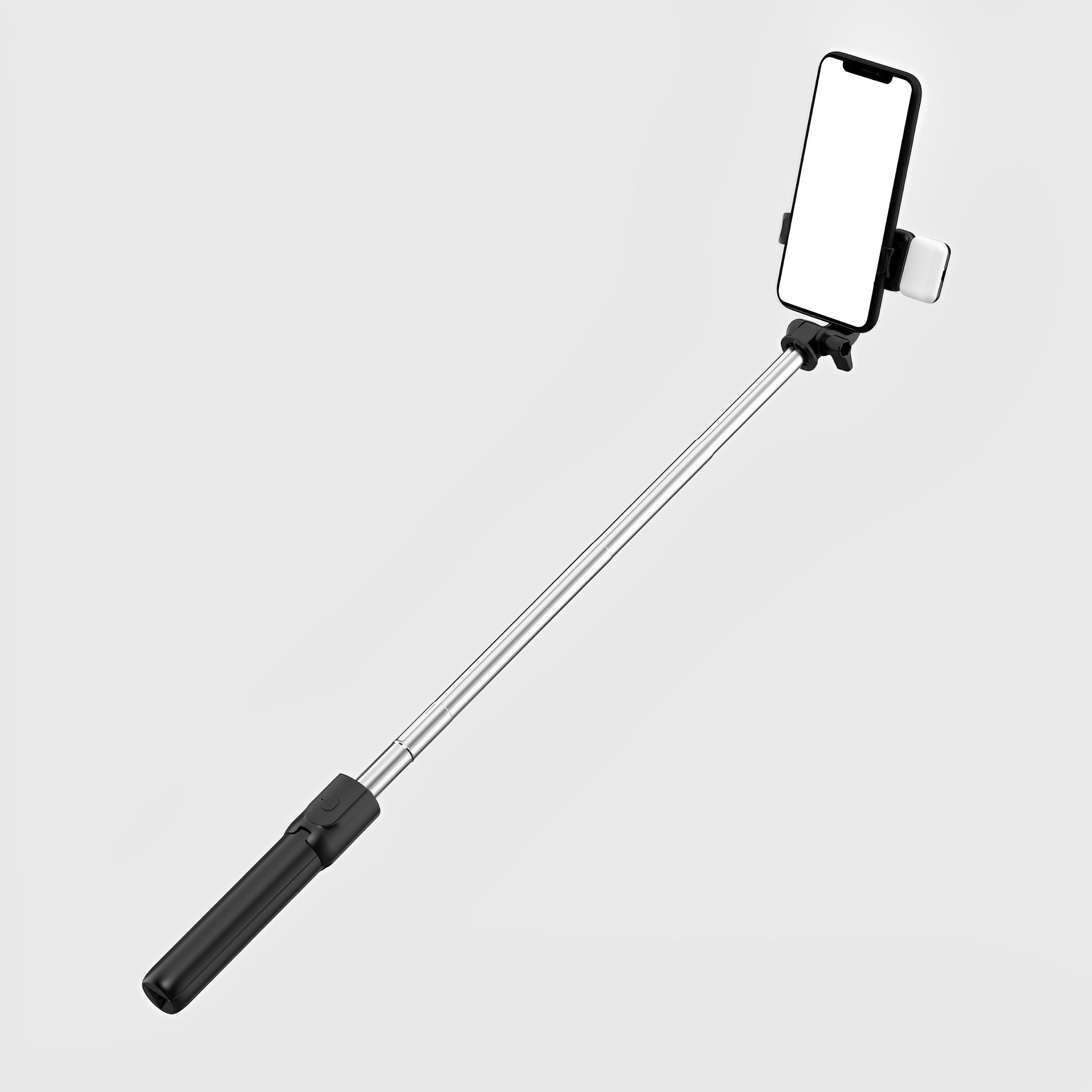 Elevkassan Selfiestick med Bluetooth & LED-lampa, i svart och silver, håller en smartphone med en tom vit skärm mot en enfärgad ljusgrå bakgrund.